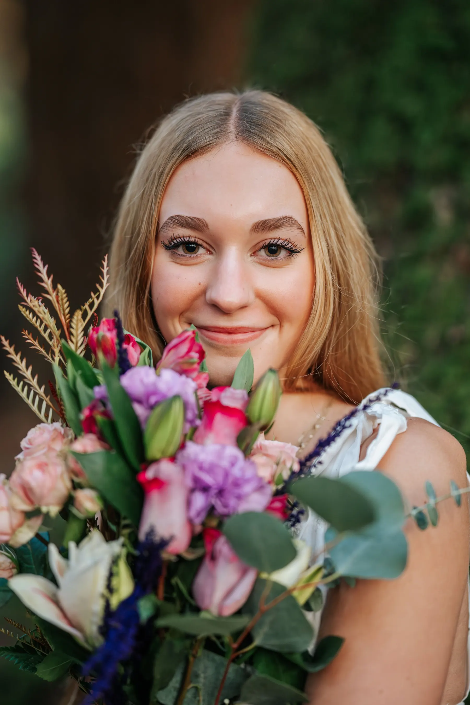 Senior portrait in backlit golden-hour light